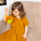 Музыкальная игрушка Азбукварик мячик хохотуша оранжево-желтый